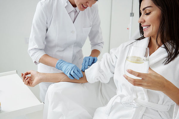 Woman getting IV therapy treatment